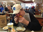 Chris eating the very popular Skyline Coney with Cheese in Cincinnati, OH.